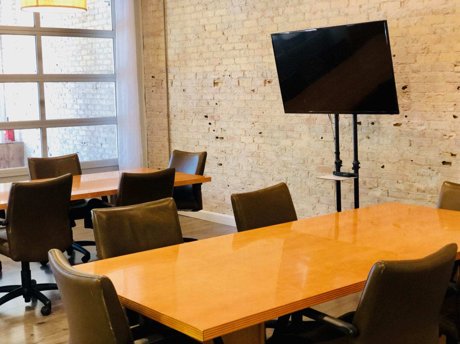 Meeting room with brick wall