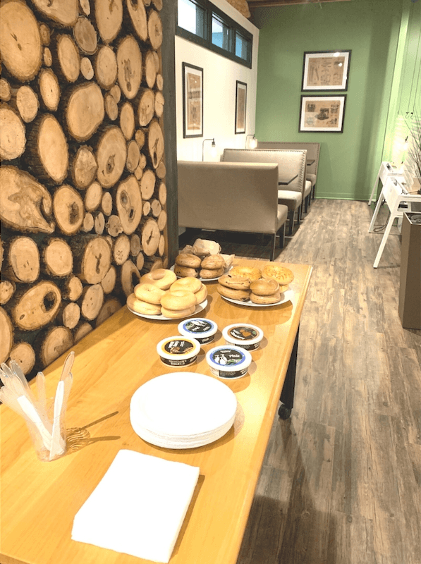 Bagels and spreads laid out for the weekly member breakfast